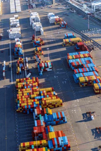 aerial-view-of-containers-in-shipping-yard-2026-03-25-02-50-26-utc (1)